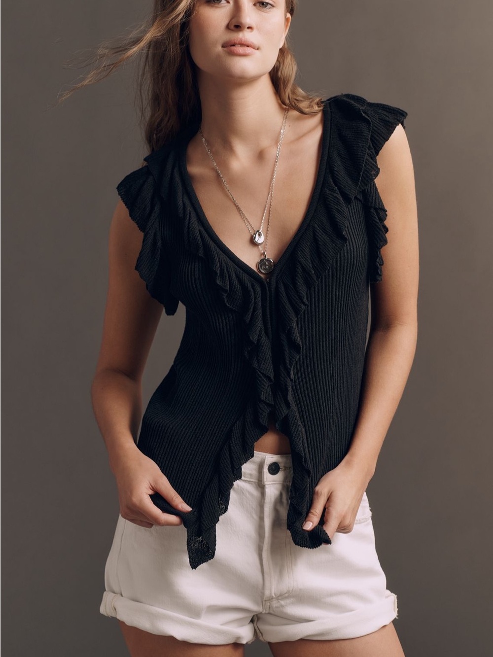 Sleeveless ruffle sweater top